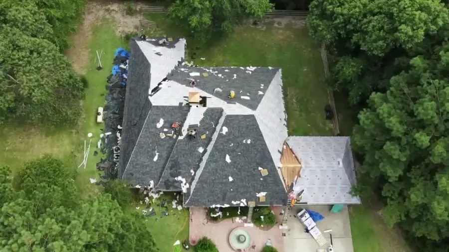 Mid install. An aerial view while the roof replacement is underway.
