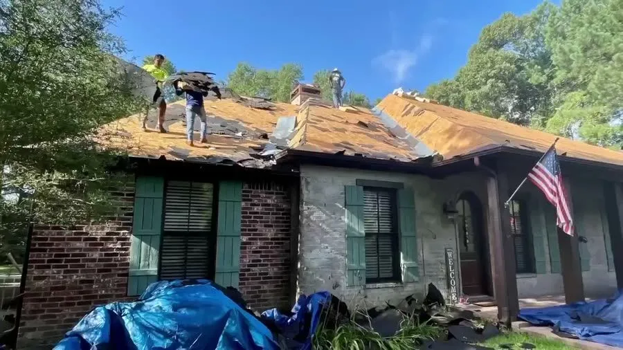 Tear off. Old shingles removed, with the roof decking exposed.