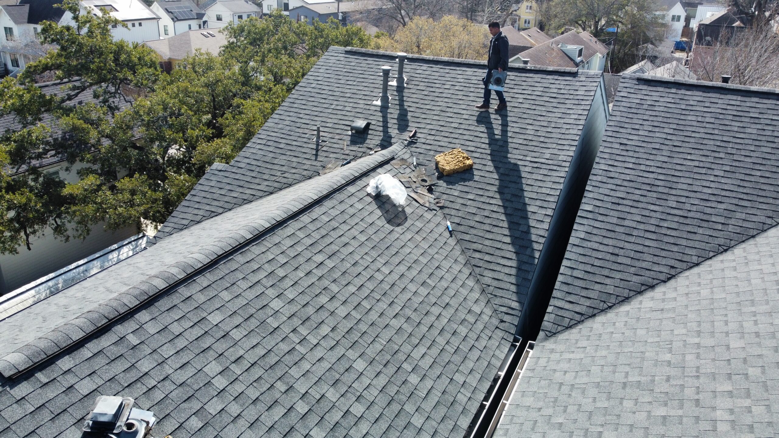 Angelman roofing and restoration working on roof